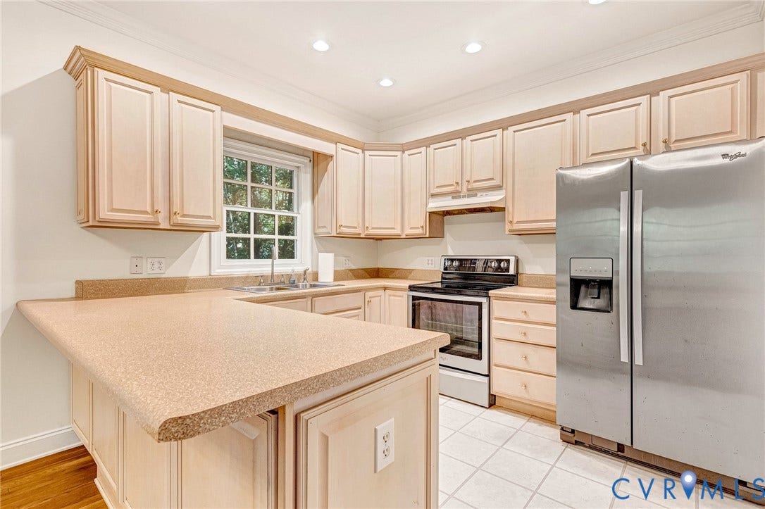 13086 Scotchtown Road, Scotchtown Area, Beaverdam, VA 23015 Kitchen featuring light-toned cabinetry, stainless steel appliances, and eat in counter