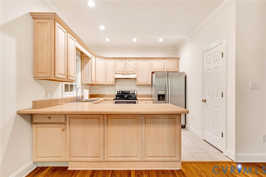 13086 Scotchtown Road, Scotchtown Area, Beaverdam, VA 23015 Kitchen with light colored cabinets and stainless steel appliances