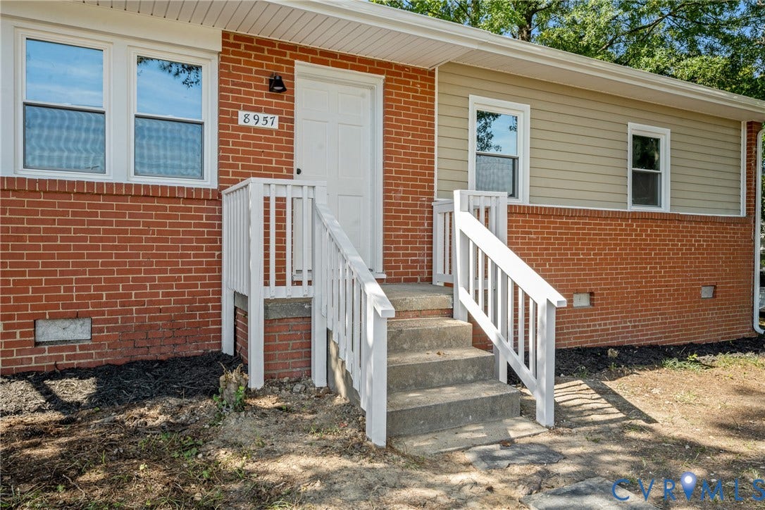 Brick facade with horizontal siding accents