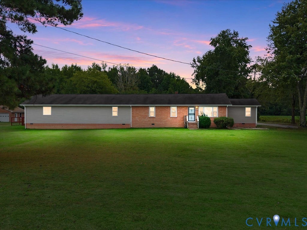 Twilight picture of front of the house