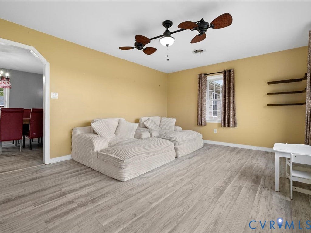 Living room with light wood-finish flooring
