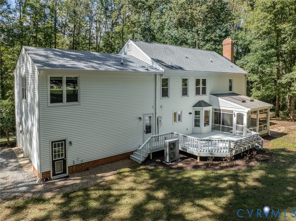 3120 McQuinn Road, Powhatan, VA 23139 Expansive backyard featuring a large composite deck, screened porch, and mature trees