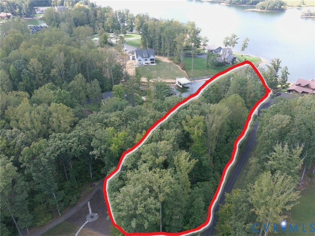 0 Wolftrap Court, Lighthouse, Bumpass, VA 23024 Wooded lot with water frontage, mature trees, and paved road access