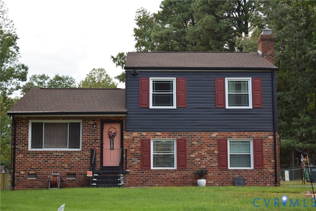 3102 Oxnard Road, Henrico, VA 23223 Brick and siding exterior with red window shutters, brown shingle roofing, and a front entry with black steps