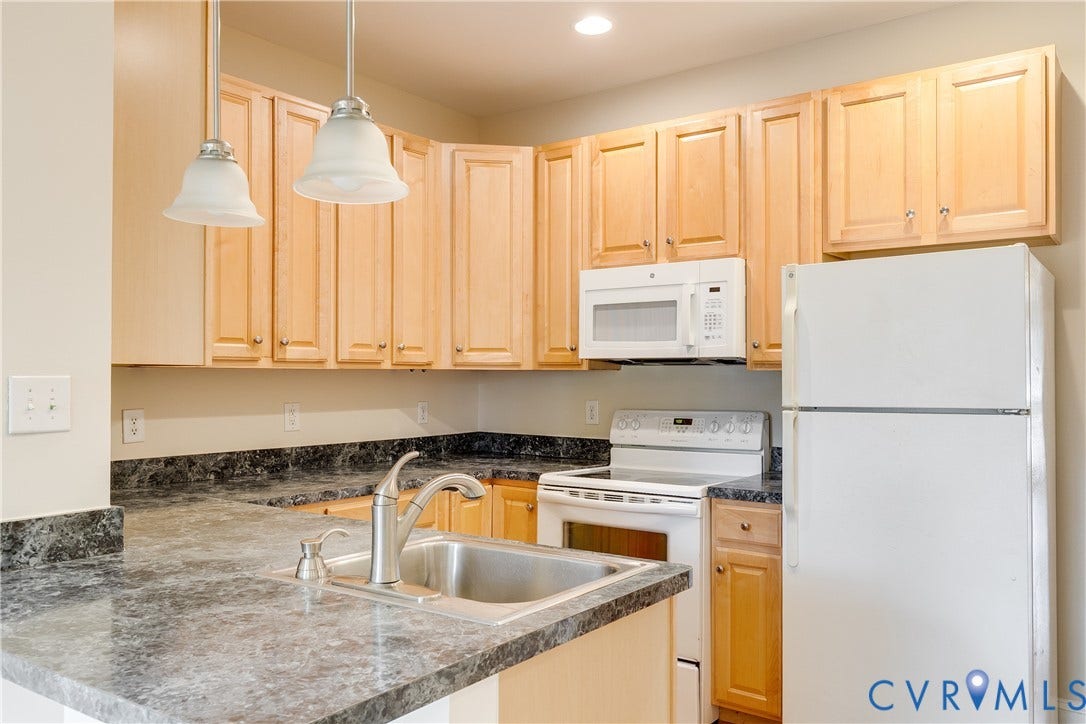 520 N 1st Street, Richmond, VA 23219 Kitchen featuring wood cabinetry, dark patterned countertops, a stainless steel sink with a gooseneck faucet, an electric range, and an over-the-range microwave