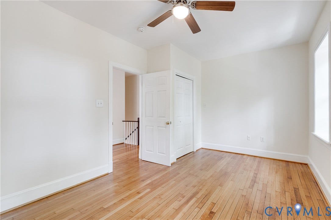 520 N 1st Street, Richmond, VA 23219 Hardwood flooring, painted white walls, white trim, recessed lighting, and a ceiling fan with integrated lighting