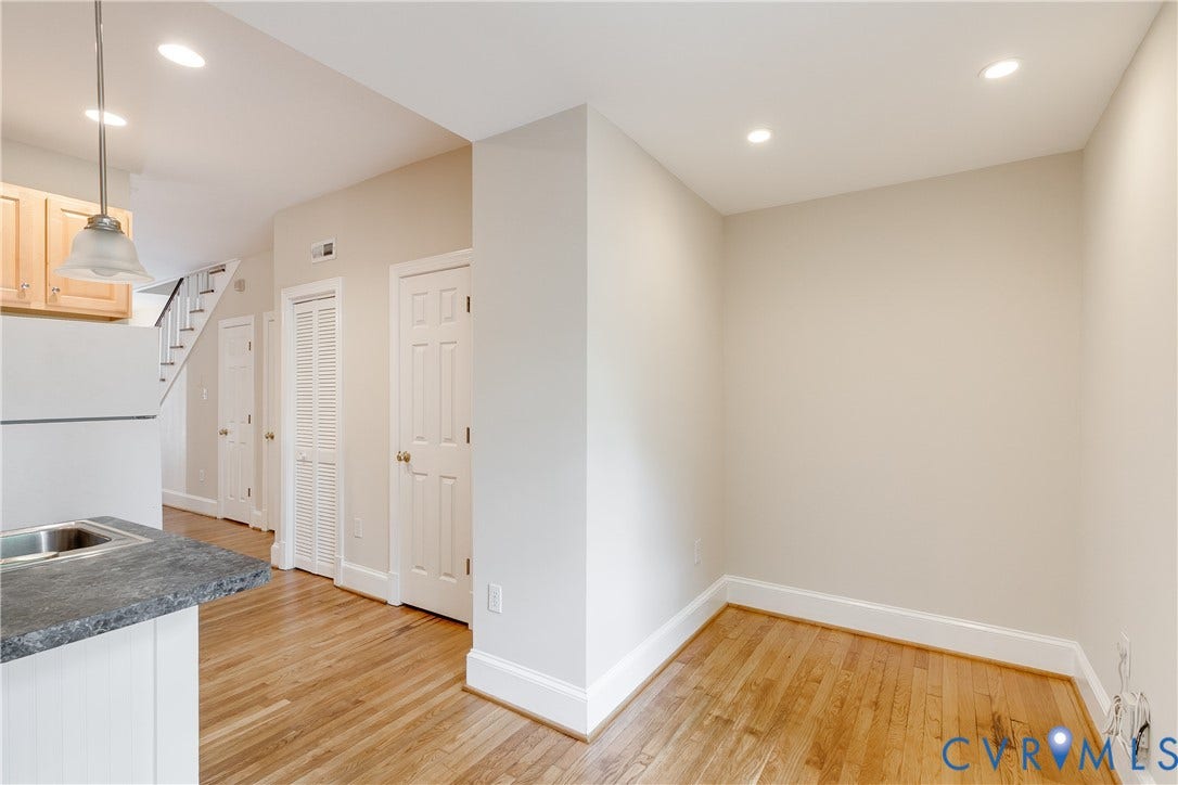 520 N 1st Street, Richmond, VA 23219 Hardwood flooring, recessed lighting, light wood-finish cabinetry, and a stainless steel sink