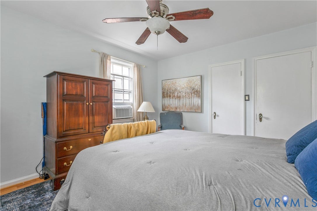 2606 Park Avenue, #U6, The Fan, Richmond, VA 23220 Ceiling fan with light fixture, window with an air conditioning unit, and two white panel doors