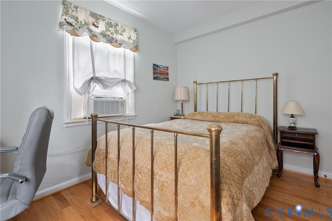 2606 Park Avenue, #U6, The Fan, Richmond, VA 23220 Hardwood flooring, window with sash, and light-colored walls