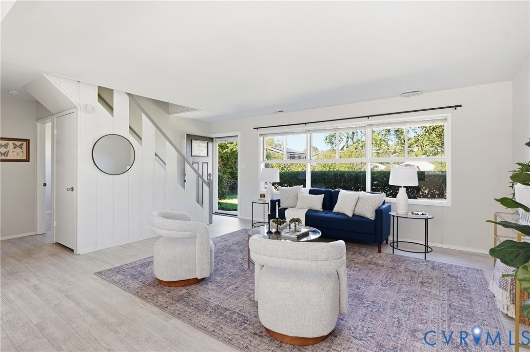 Light wood-finish flooring with an open-concept living space