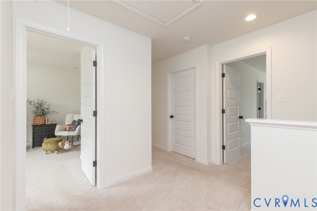 Light-colored carpeting throughout, white interior walls, and recessed ceiling lighting
