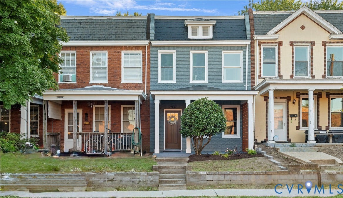2931 W Leigh Street, Scotts Addition, Richmond, VA 23230 Two-story brick facade with a covered front porch and multi-pane windows