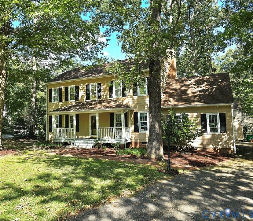 4207 Brixton Road, Creekwood, Chesterfield, VA 23832 Two-story traditional residence featuring a front porch with white railings, a light-colored exterior, and dark window shutters