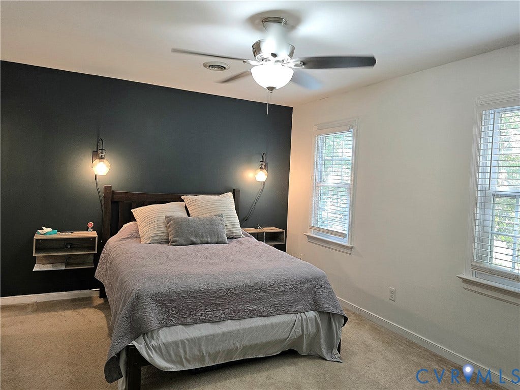 4207 Brixton Road, Creekwood, Chesterfield, VA 23832 Wall-mounted sconce lighting, ceiling fan with integrated lighting, and two double-hung windows