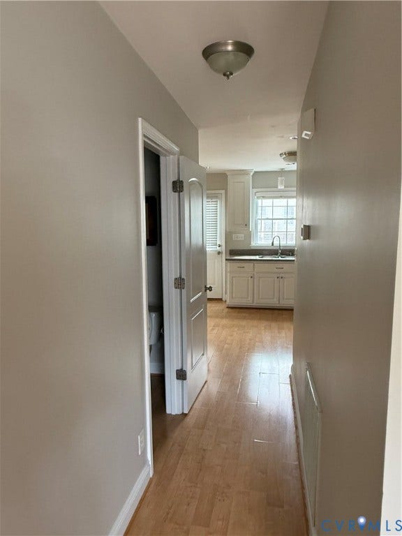1709 Kemper Street, Richmond, VA 23220 Wood-finish flooring throughout, with white trim and neutral wall tones