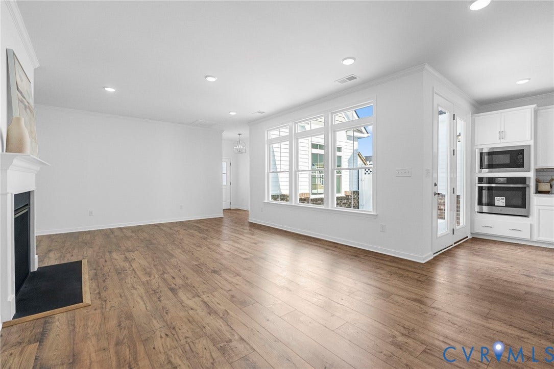 6726 Mayland Ridge Lane, The Villas At Swift Creek, Moseley, VA 23120 Family room with fireplace + natural light