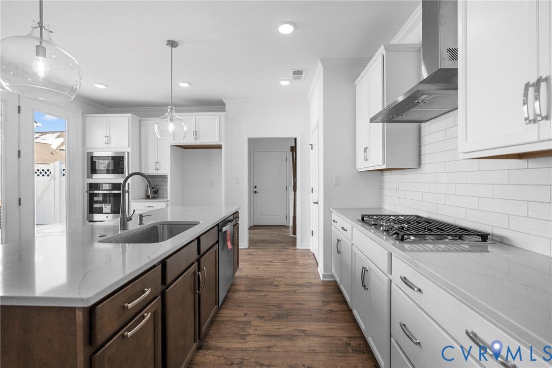 6726 Mayland Ridge Lane, The Villas At Swift Creek, Moseley, VA 23120 Quartz countertops, Tile backsplash, GE appliances