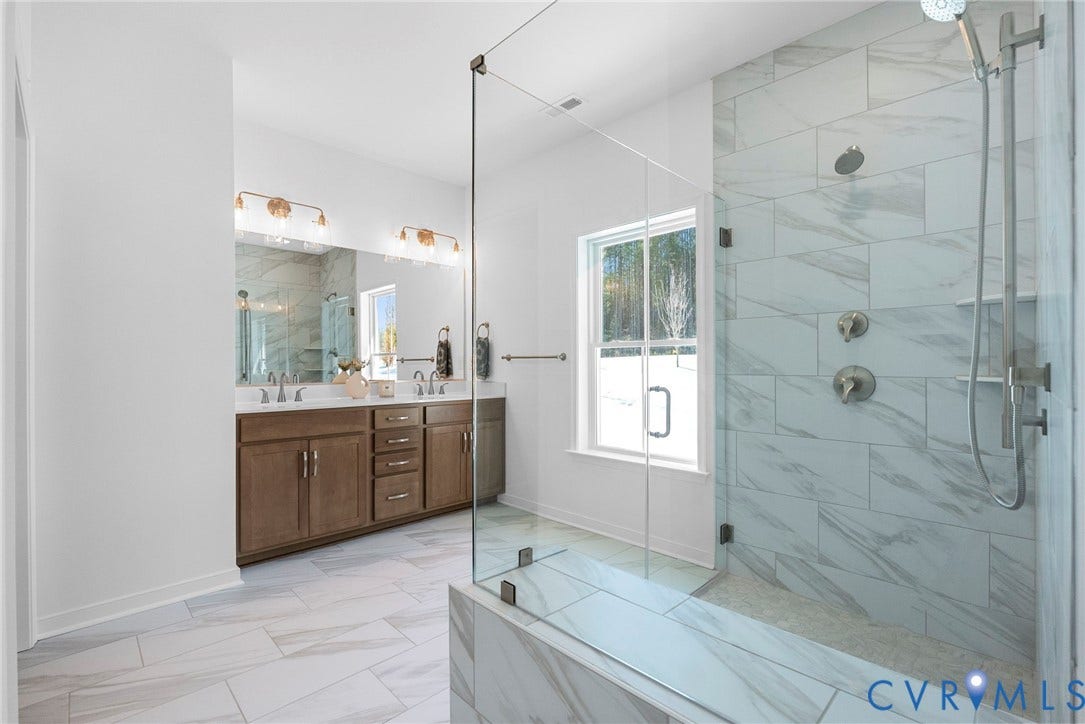 6726 Mayland Ridge Lane, The Villas At Swift Creek, Moseley, VA 23120 Primary bathroom with tiled curbless shower + dual vanity
