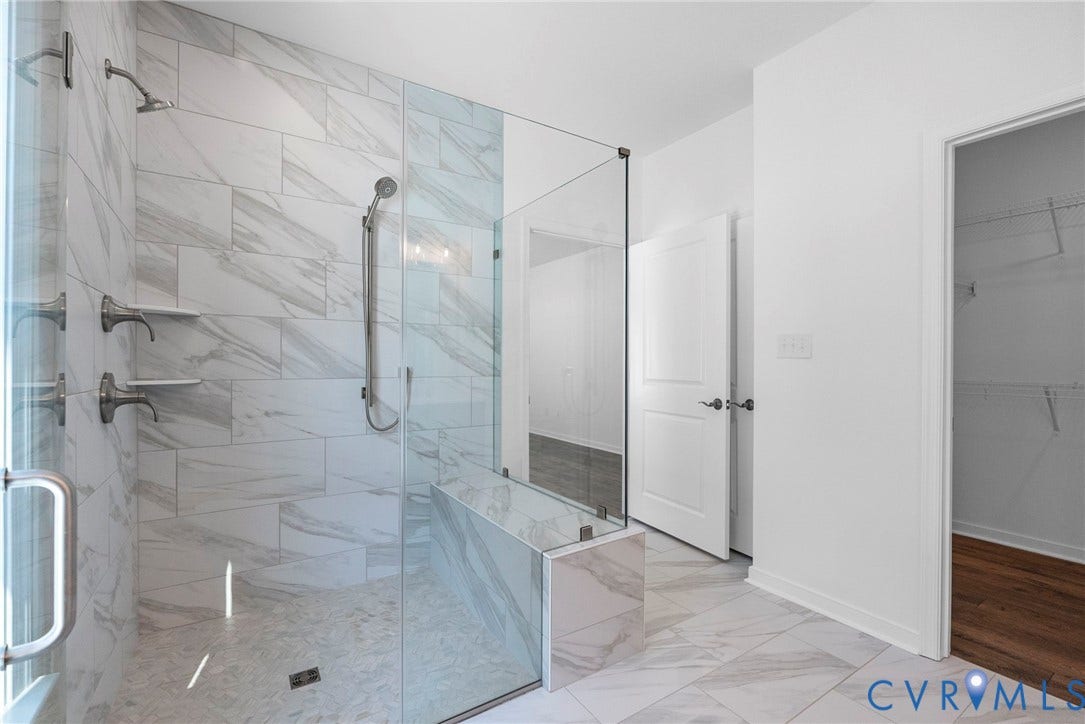 6726 Mayland Ridge Lane, The Villas At Swift Creek, Moseley, VA 23120 Primary bathroom with tiled curbless shower + dual vanity + WIC