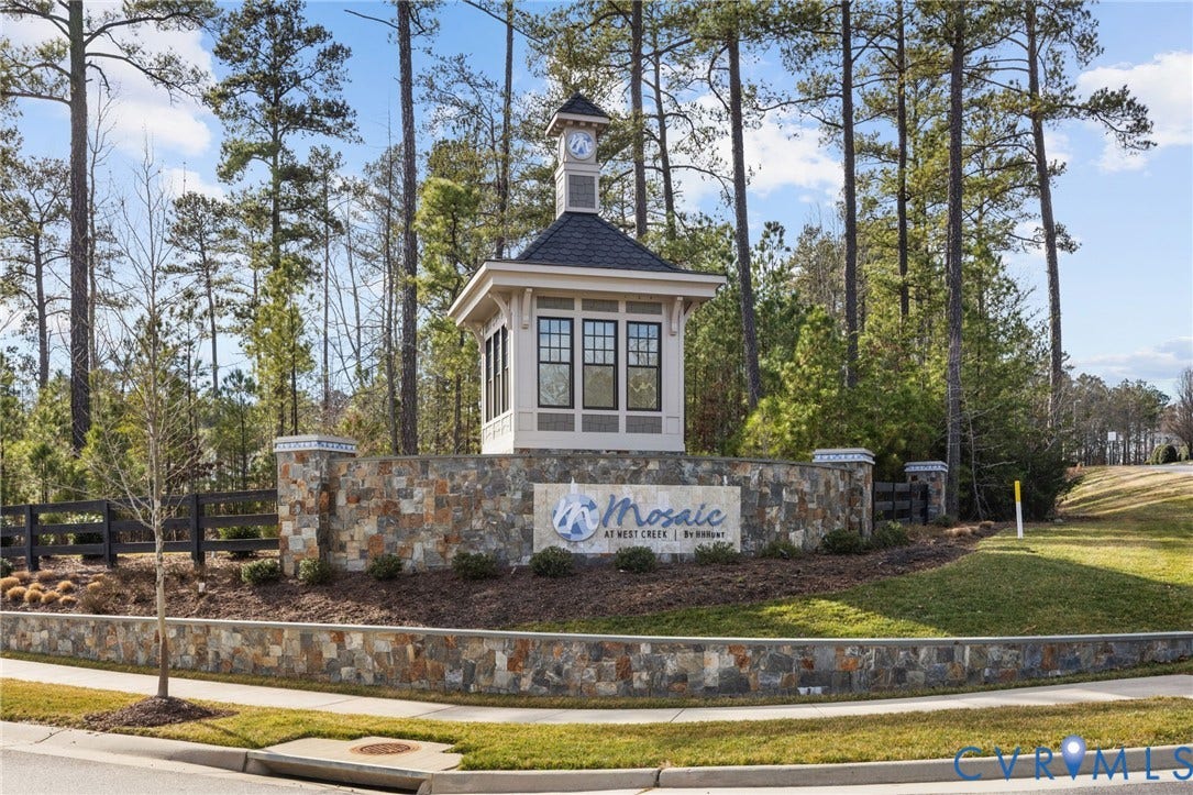 15750 Mosaic Creek Boulevard, Henrico, VA 23238 Stone-clad entrance wall featuring a clock tower structure