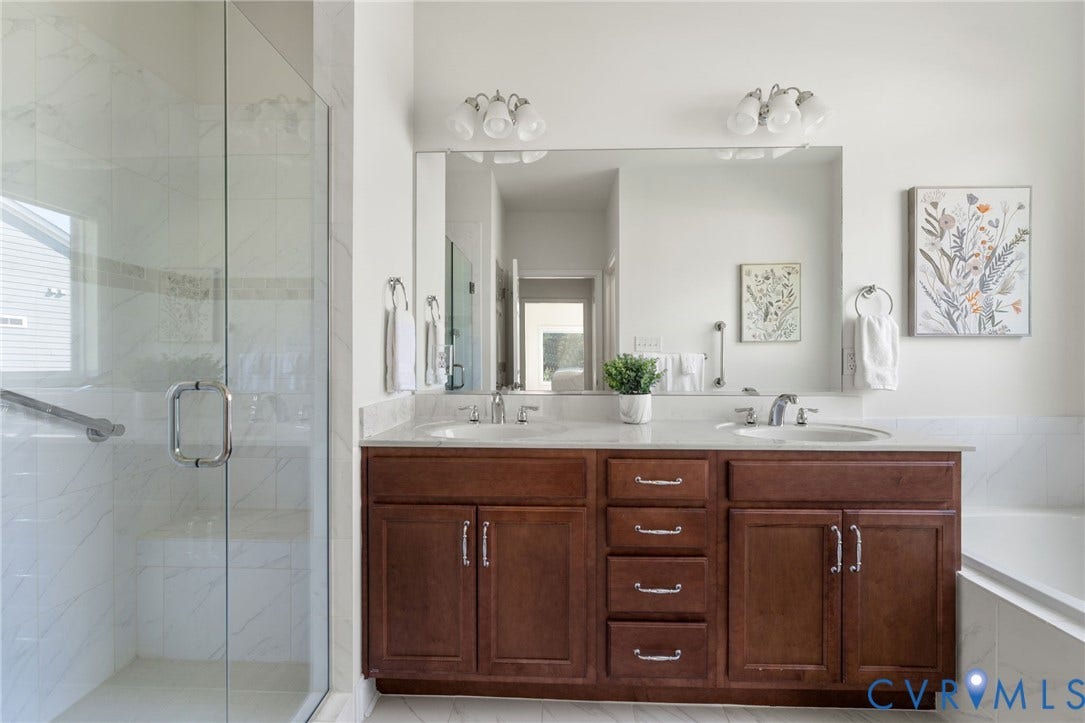 15750 Mosaic Creek Boulevard, Henrico, VA 23238 Dual vanity with wood-finish cabinetry and chrome hardware