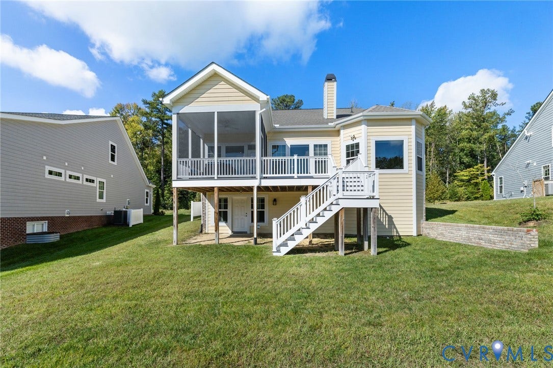 15750 Mosaic Creek Boulevard, Henrico, VA 23238 Expansive backyard featuring a screened-in porch, multi-level decking, and a walk-out lower level