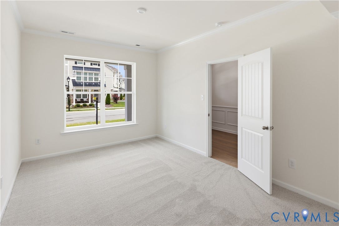 1st Floor Guest Room. This photo shows a similar floorplan and quality level to Eastwood Homes. Actual design selections and layout may vary.