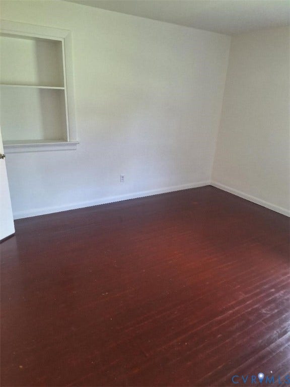 111 Damascus Drive, Richmond, VA 23227 Wood-finish flooring with light-toned walls and a built-in shelving unit