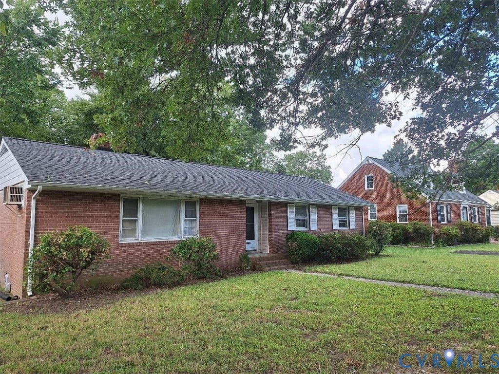 111 Damascus Drive, Richmond, VA 23227 Brick exterior with a dark shingle roof, white trim, and a concrete pathway