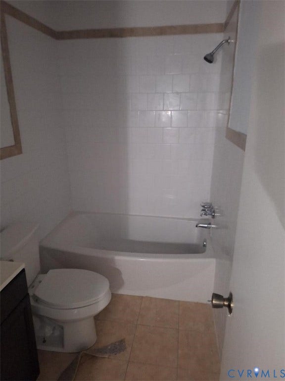 111 Damascus Drive, Richmond, VA 23227 White subway tile shower surround with a contrasting decorative border, standard bathtub with chrome fixtures, and a white toilet