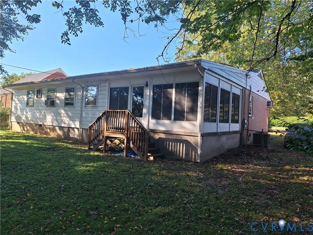 111 Damascus Drive, Richmond, VA 23227 Rear exterior featuring a sunroom addition, wood deck with stairs, and multiple windows