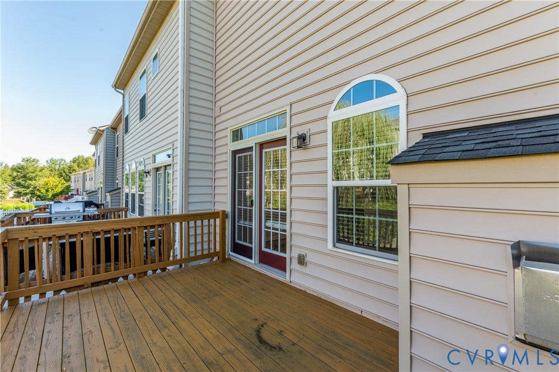 Expansive wood-finish deck with a wood railing system