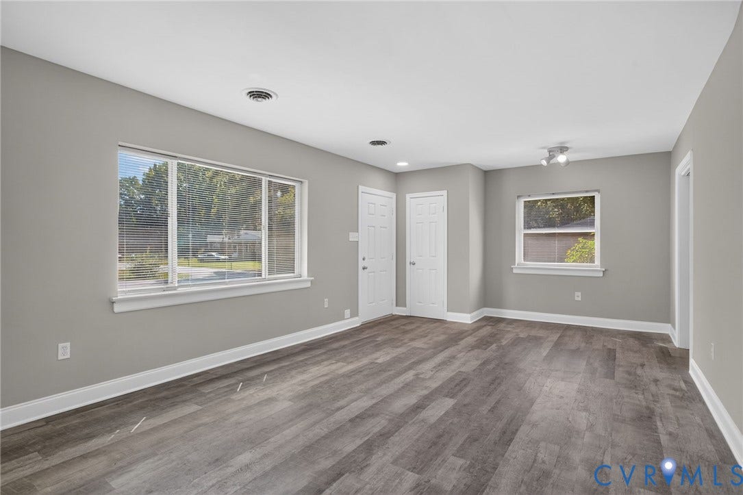 1118 Andros Road, Richmond, VA 23225 new LVP flooring, recessed lighting, and a large window with blinds