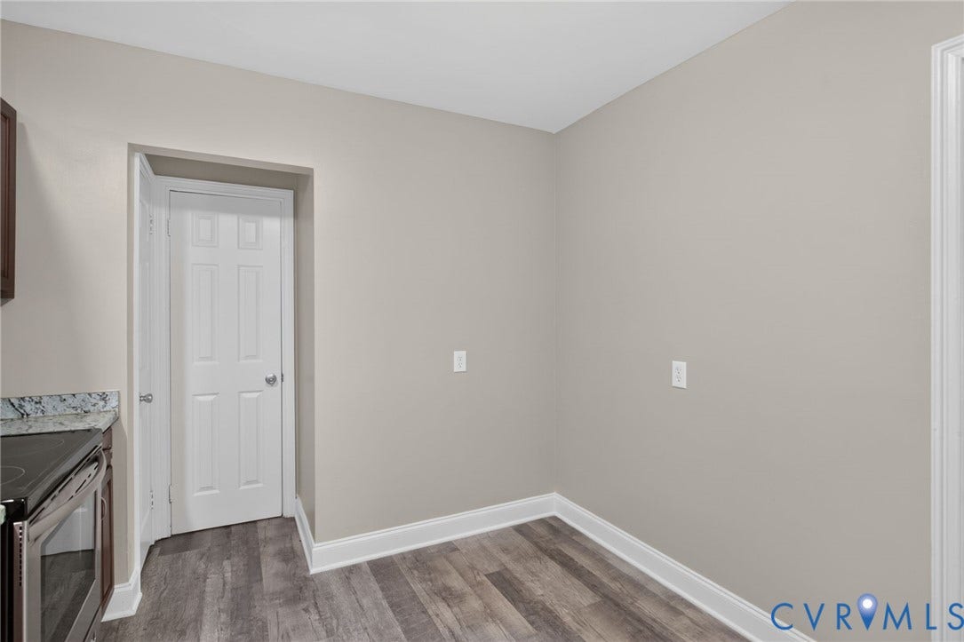 1118 Andros Road, Richmond, VA 23225 light neutral wall paint, white trim, and a white six-panel interior door