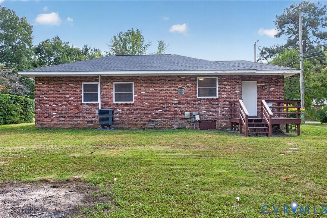 1118 Andros Road, Richmond, VA 23225 Brick exterior with dark shingle roofing