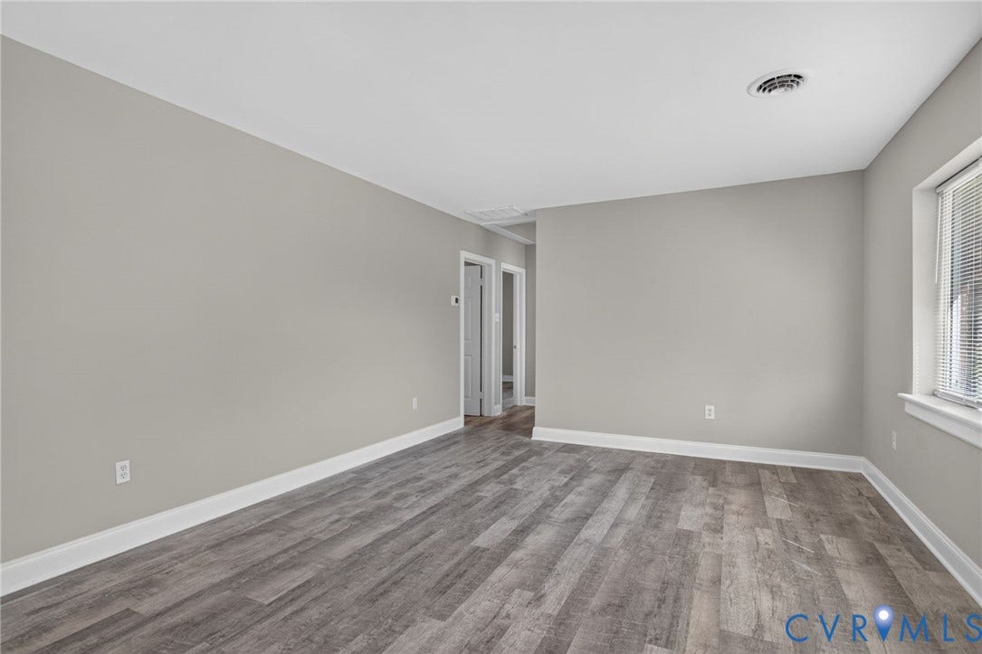 1118 Andros Road, Richmond, VA 23225 new LVP flooring, light grey wall paint, and white trim throughout