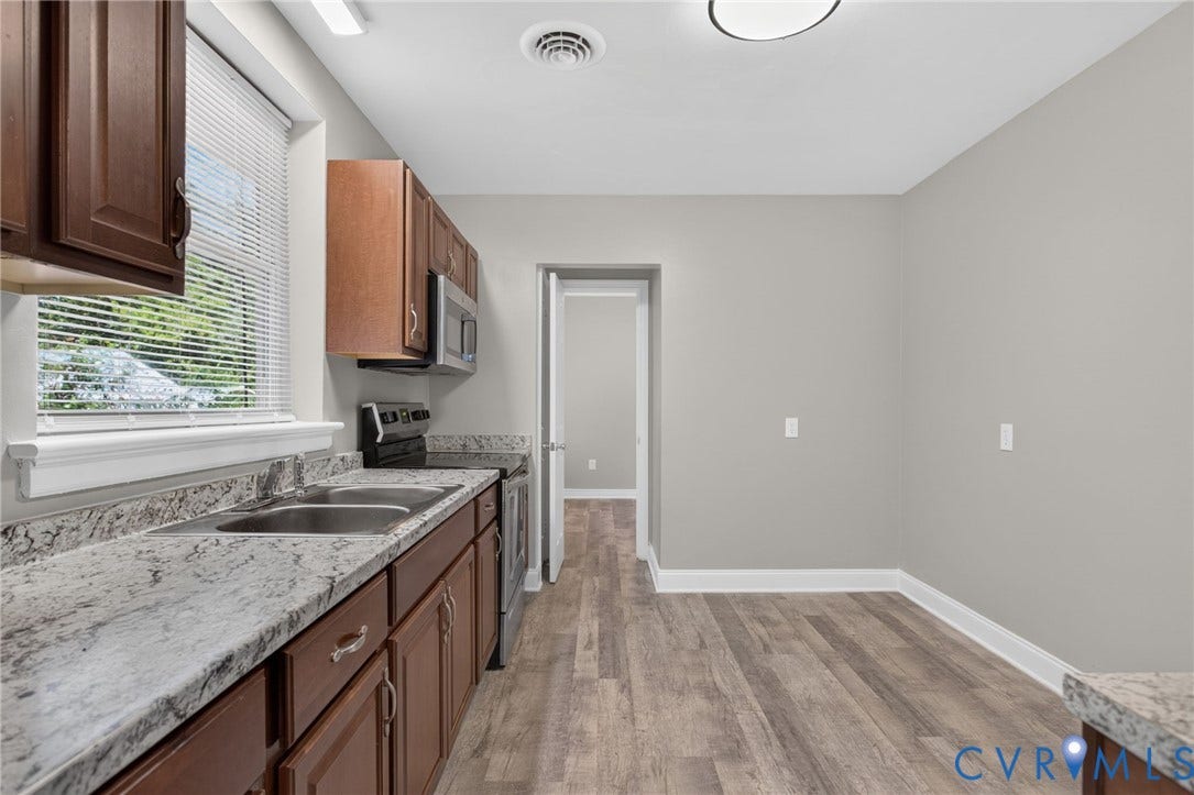 1118 Andros Road, Richmond, VA 23225 kitchen featuring rich wood cabinetry, stainless steel appliances