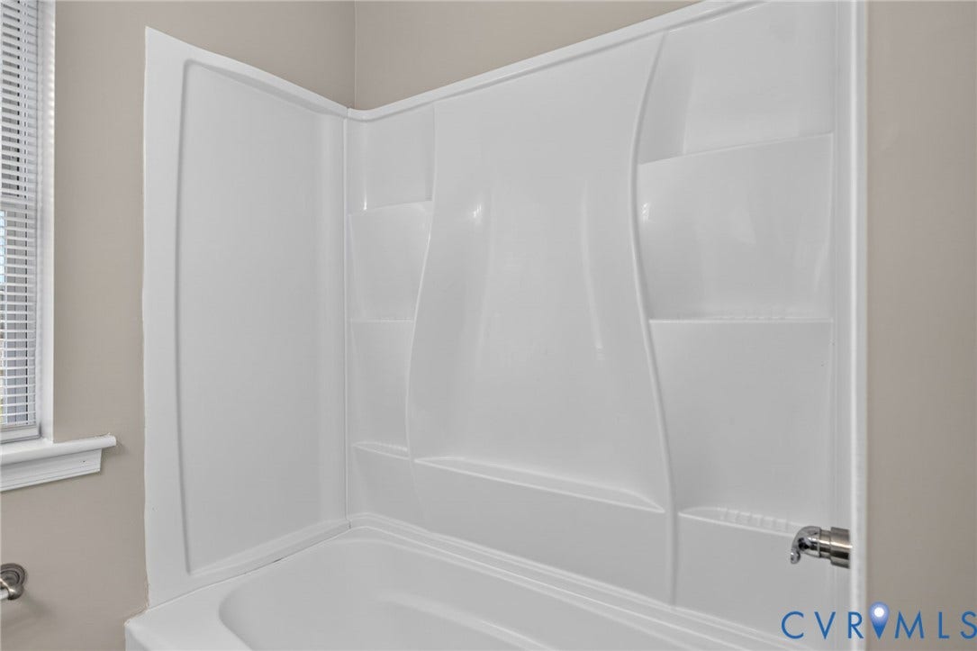 1118 Andros Road, Richmond, VA 23225 White fiberglass tub and shower combination with integrated shelving