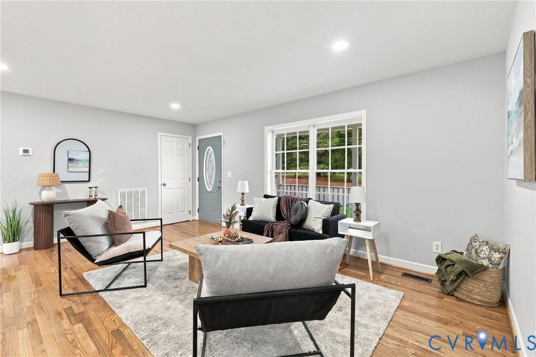 6409 Walmsley Boulevard, Chesterfield, VA 23224 Living area featuring wood-finish flooring, recessed lighting, and a multi-pane window with a grid pattern