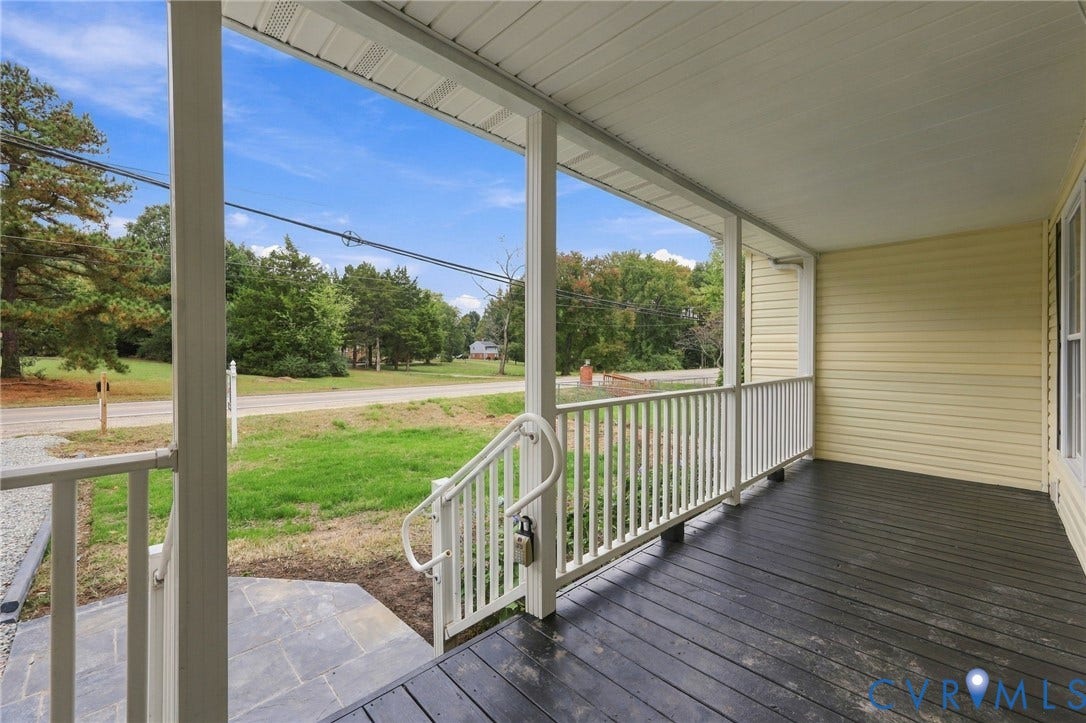 6409 Walmsley Boulevard, Chesterfield, VA 23224 Covered front porch featuring dark-toned wood-finish flooring, white railing, and a stone walkway