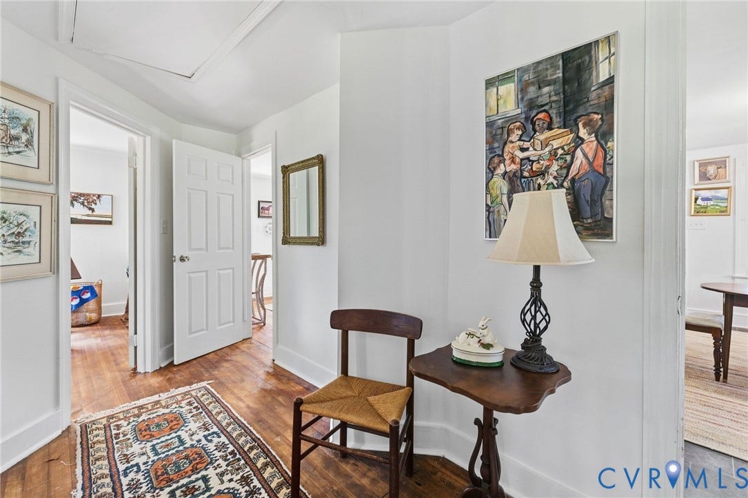 Hardwood flooring throughout the hallway.