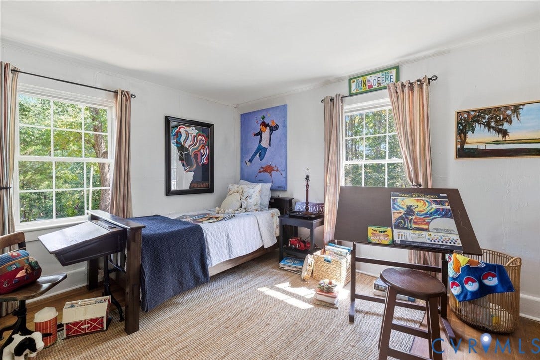Dual windows with white frames, curved ceiling, and light-colored walls.