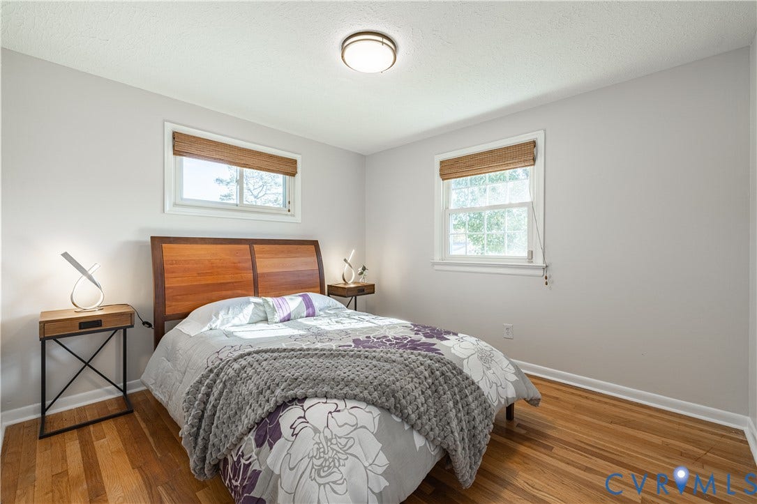 5312 Marian Street, Richmond, VA 23226 Hardwood flooring, light gray wall finishes, white trim, and a ceiling-mounted light fixture