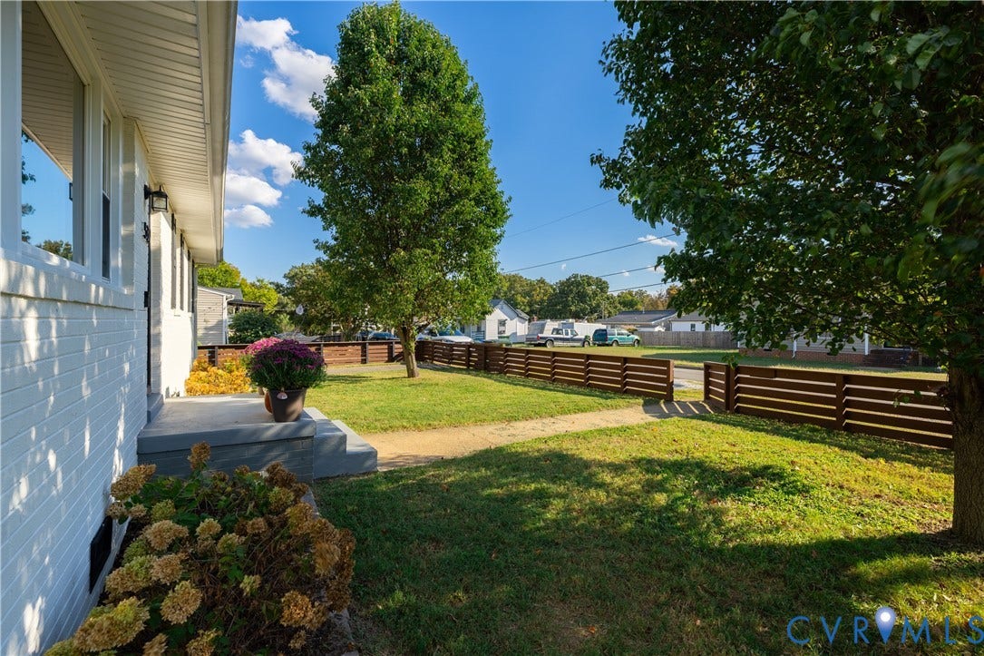 5312 Marian Street, Richmond, VA 23226 White brick exterior with a gray concrete porch and steps