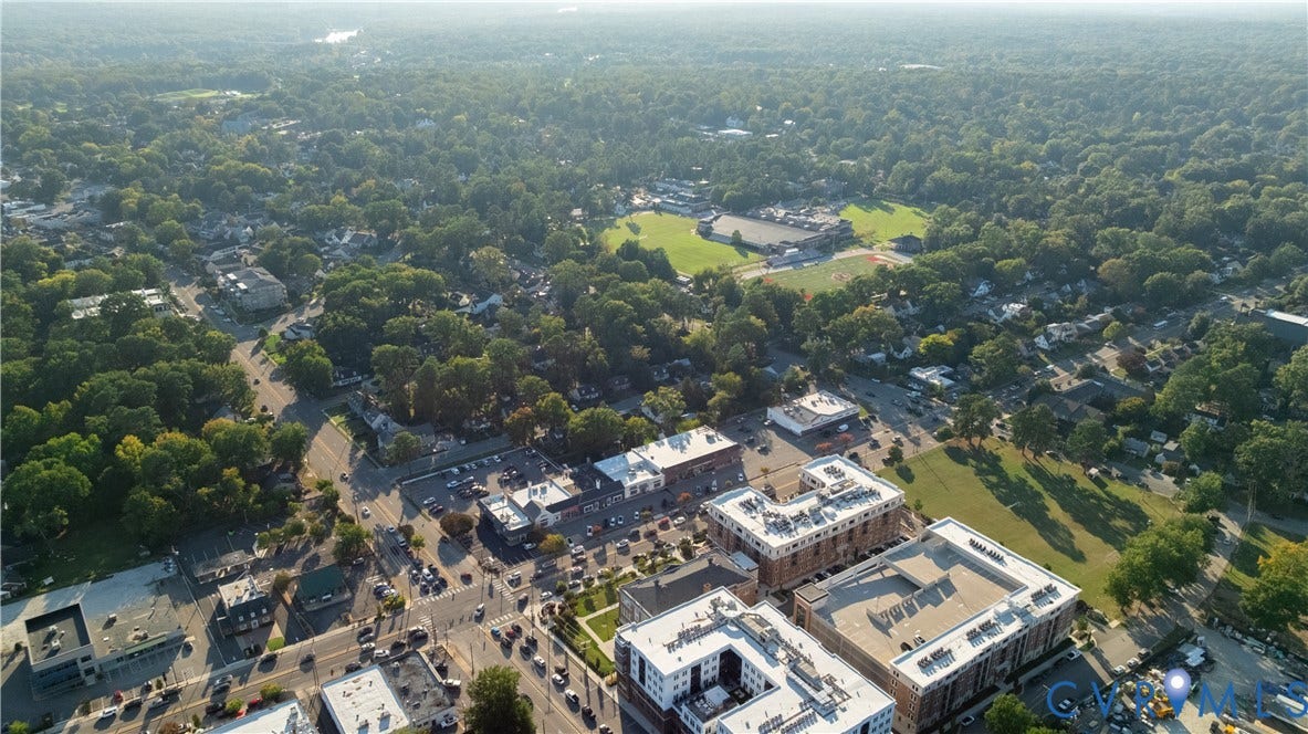5312 Marian Street, Richmond, VA 23226 Aerial perspective showcasing a dense tree canopy, urban infrastructure, and commercial buildings