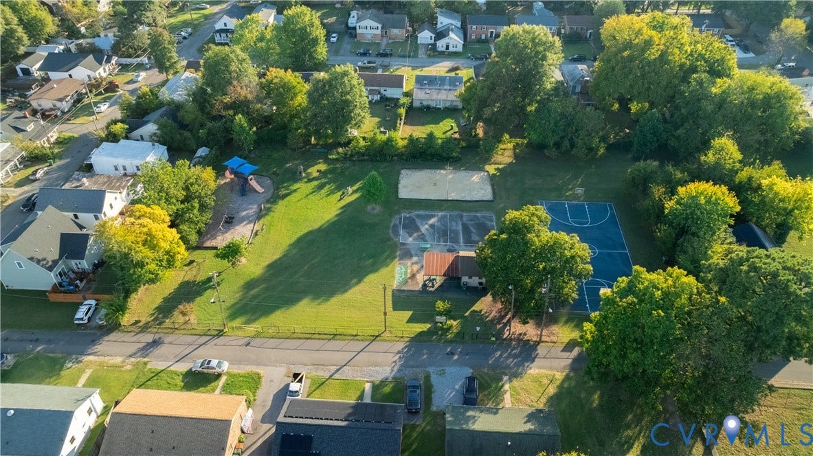 5312 Marian Street, Richmond, VA 23226 Pocket Park featuring a basketball court, playground, and open lawn areas