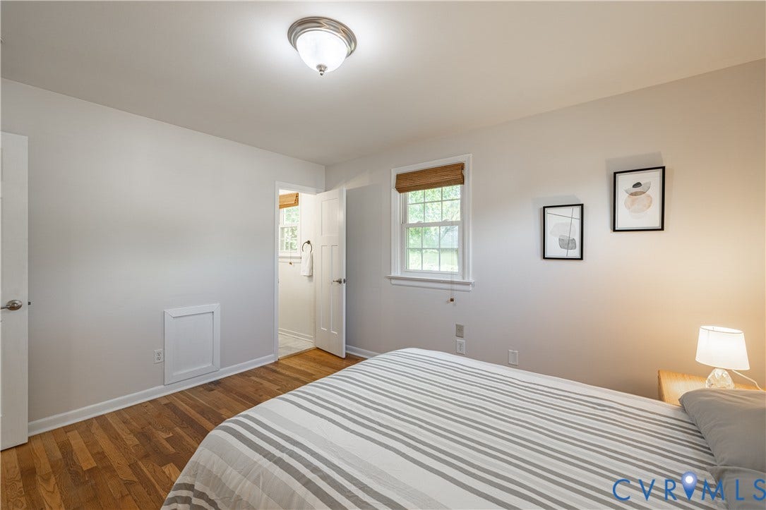 5312 Marian Street, Richmond, VA 23226 Wood-finish flooring, white trim, and a flush mount ceiling light