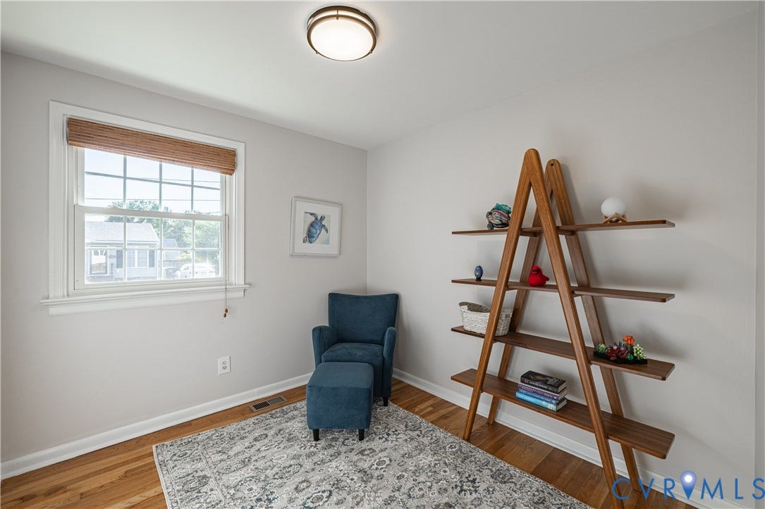 5312 Marian Street, Richmond, VA 23226 Hardwood flooring with white trim, window with natural light, and ceiling-mounted light fixture