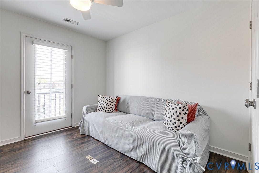 1733 W Cary Street, Richmond, VA 23220 Bedroom 3 wood-finish flooring, white walls, and a ceiling fan with integrated lighting