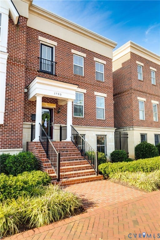 1733 W Cary Street, Richmond, VA 23220 Brick exterior featuring white columned entry, and black metal railing